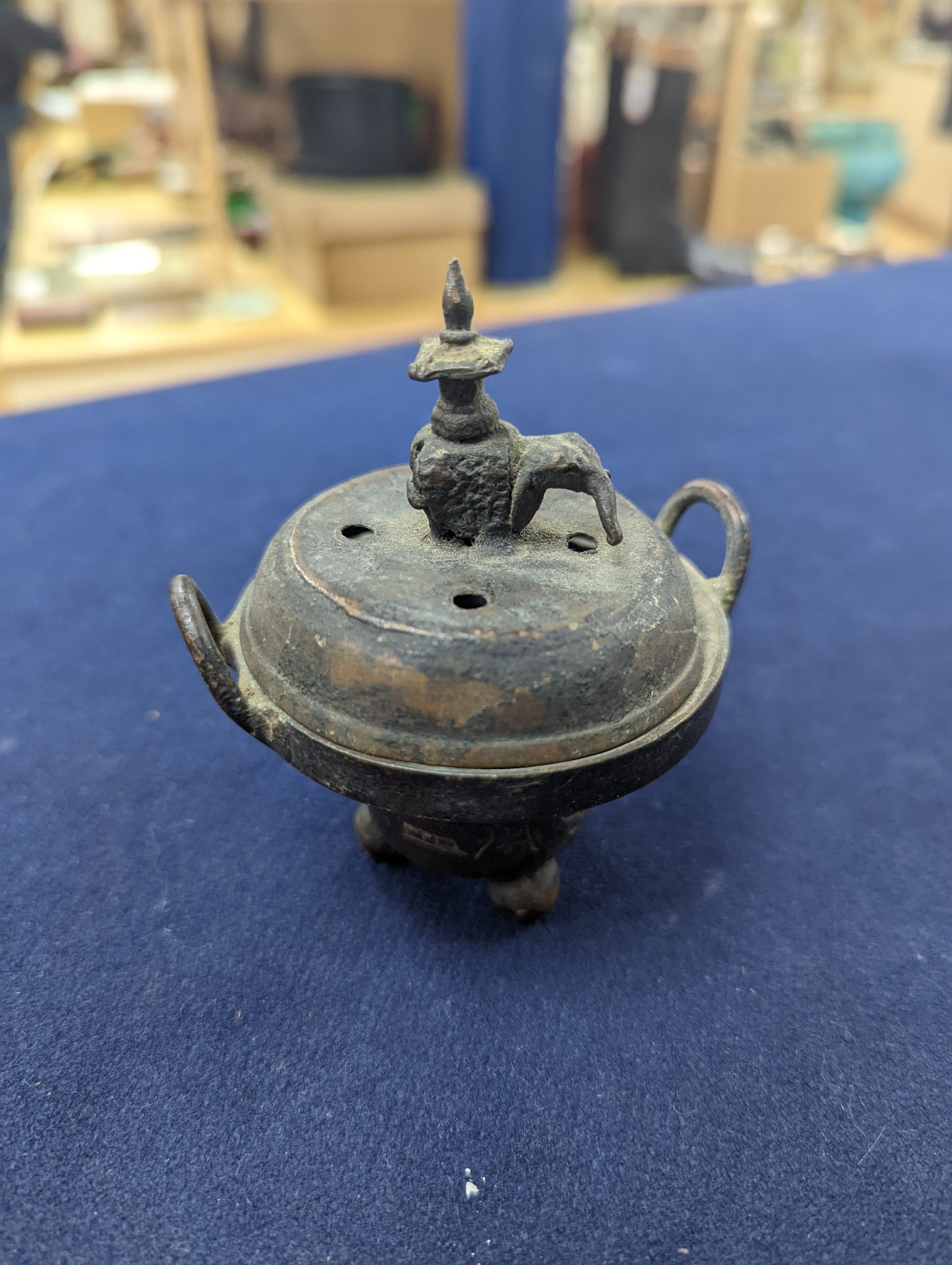 A Chinese gilt copper figure, a Chinese Dog of Fo, a bell, a censer, six Indian bronze figures and a scroll box